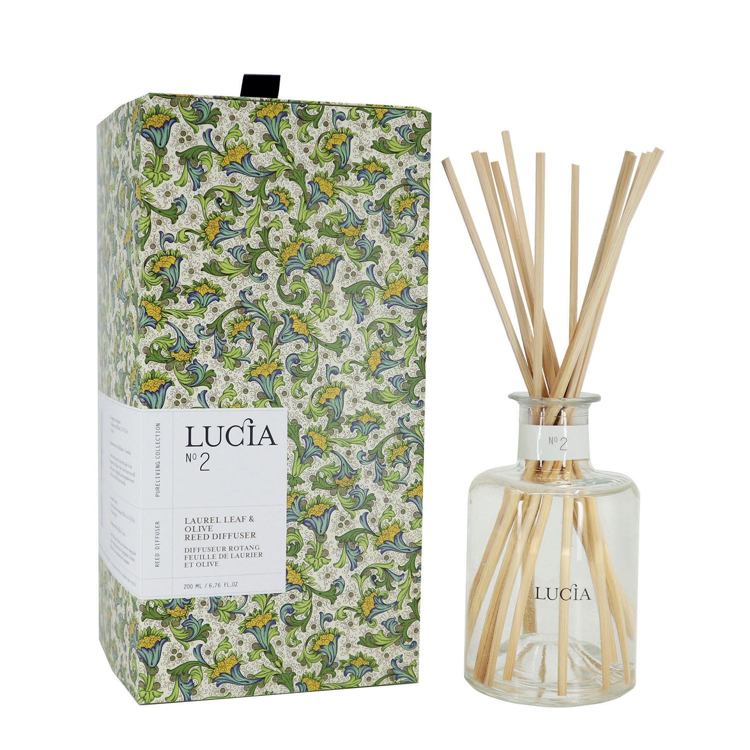 Diffuseur à bâtons bouteille claire et boîte en carton aux motifs verts.